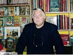 Michel Deligne dans sa librairie pris en photo par Jean-Jacques Procureur.